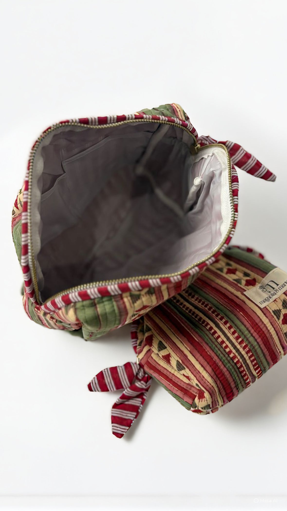 Decorative fabric pouch with a patterned design on a white background