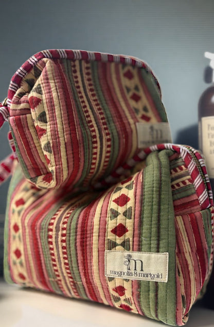 Striped fabric bag with a brand label on a blurred background