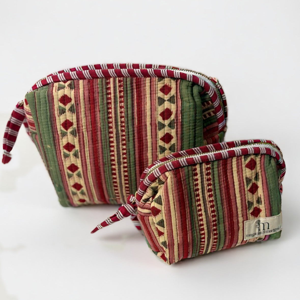 Two patterned fabric pouches on a white background